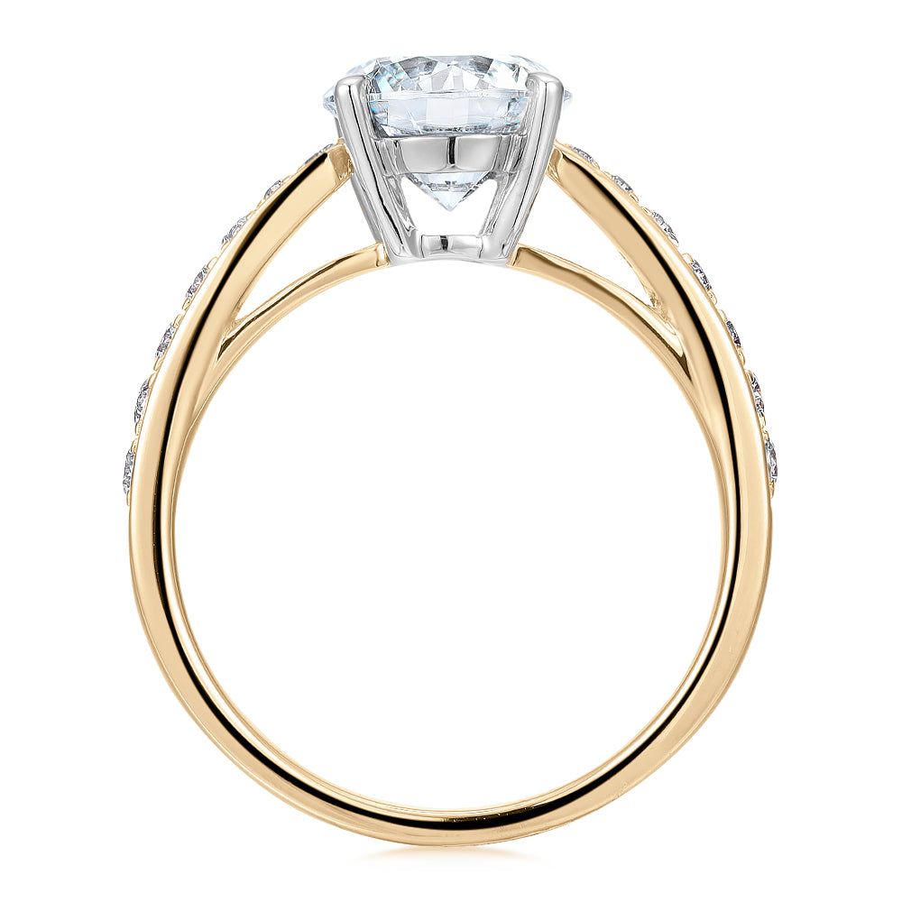 Round Brilliant shouldered engagement ring with 2.32 carats* of diamond simulants in 14 carat yellow and white gold