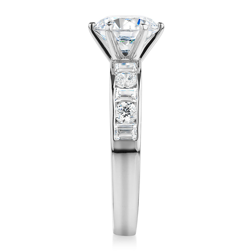 Round Brilliant and Baguette shouldered engagement ring with 2.72 carats* of diamond simulants in 14 carat white gold