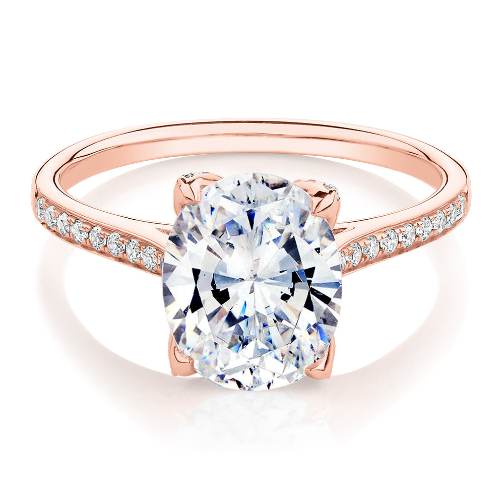 Oval and Round Brilliant shouldered engagement ring with 2.83 carats* of diamond simulants in 14 carat rose gold
