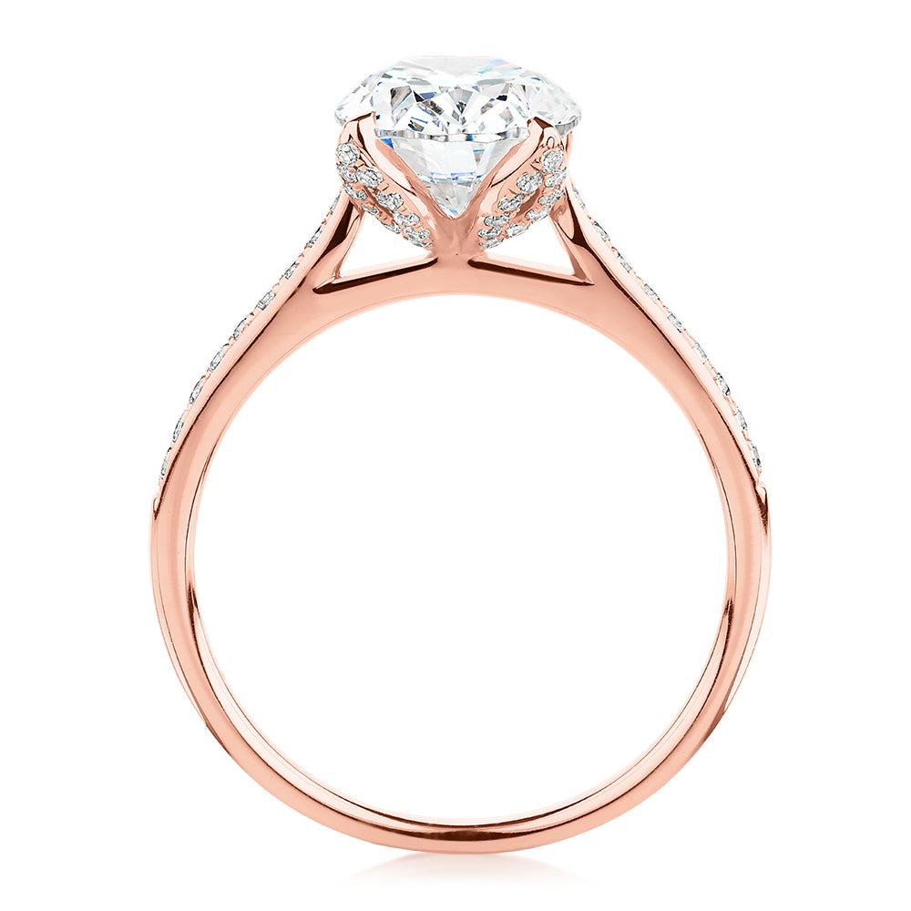 Oval and Round Brilliant shouldered engagement ring with 2.83 carats* of diamond simulants in 14 carat rose gold