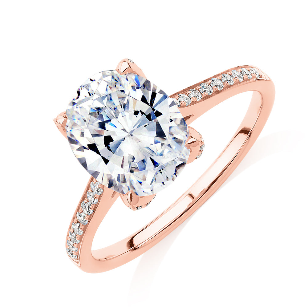 Oval and Round Brilliant shouldered engagement ring with 2.83 carats* of diamond simulants in 14 carat rose gold