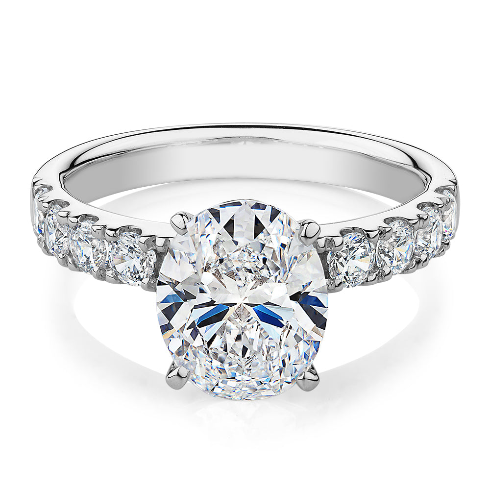 Oval shouldered engagement ring with 3.18 carats* of diamond simulants in 14 carat white gold