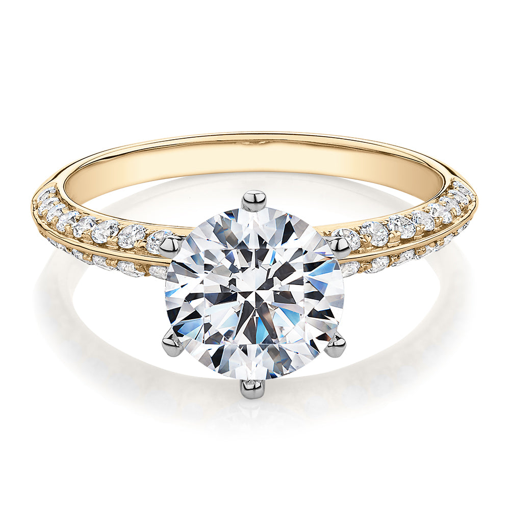 Round Brilliant shouldered engagement ring with 2.47 carats* of diamond simulants in 14 carat yellow and white gold