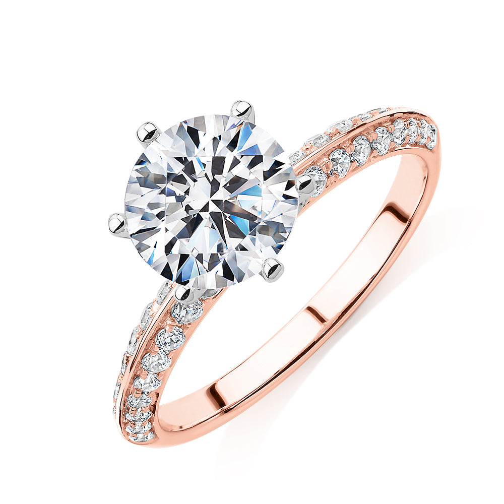 Round Brilliant shouldered engagement ring with 2.47 carats* of diamond simulants in 14 carat rose and white gold