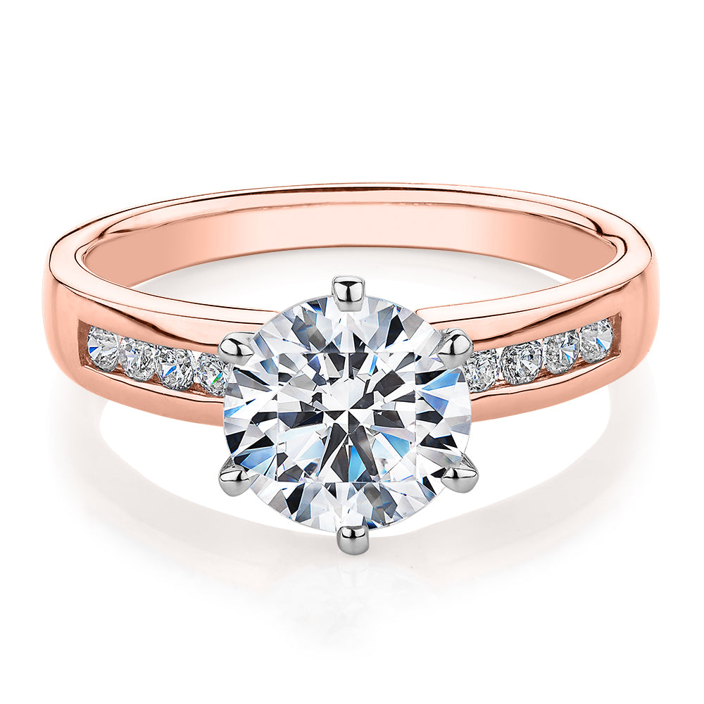 Round Brilliant shouldered engagement ring with 2.2 carats* of diamond simulants in 14 carat rose and white gold