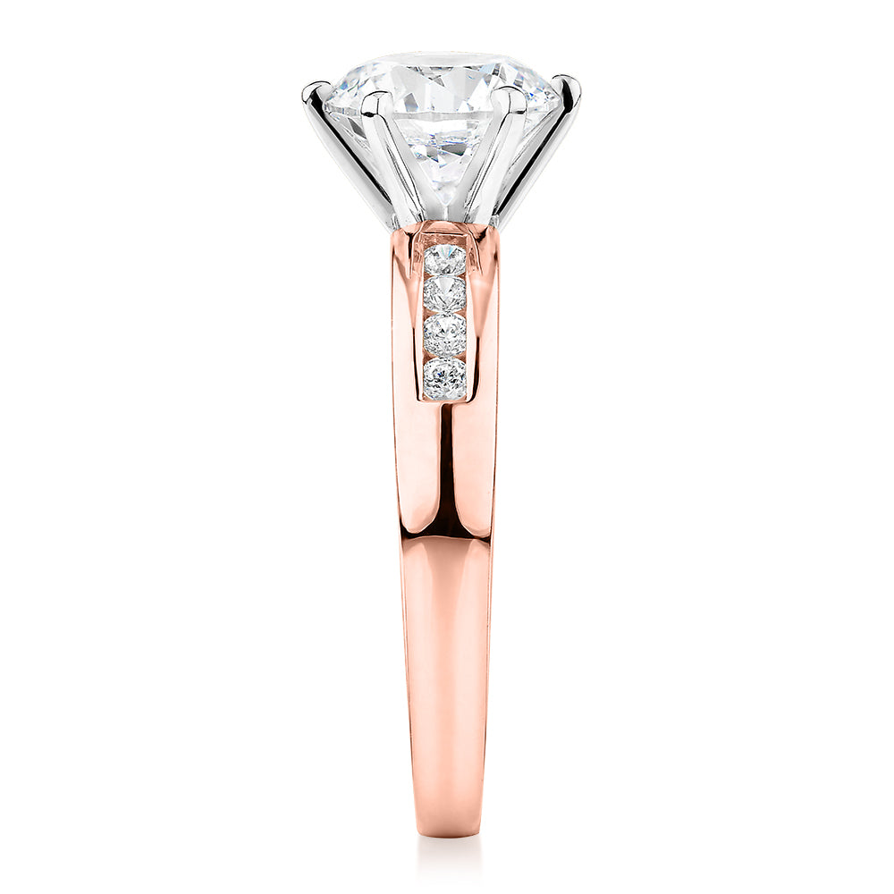 Round Brilliant shouldered engagement ring with 2.2 carats* of diamond simulants in 14 carat rose and white gold