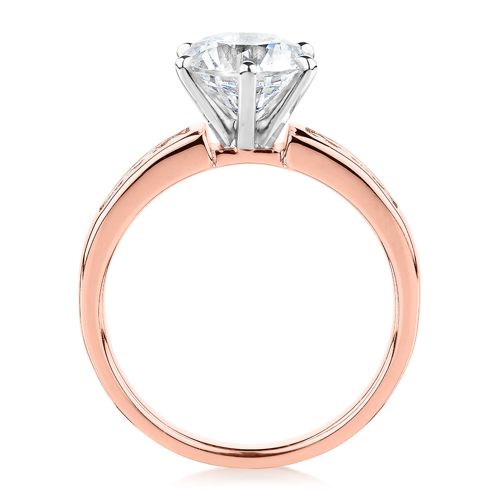 Round Brilliant shouldered engagement ring with 2.2 carats* of diamond simulants in 14 carat rose and white gold