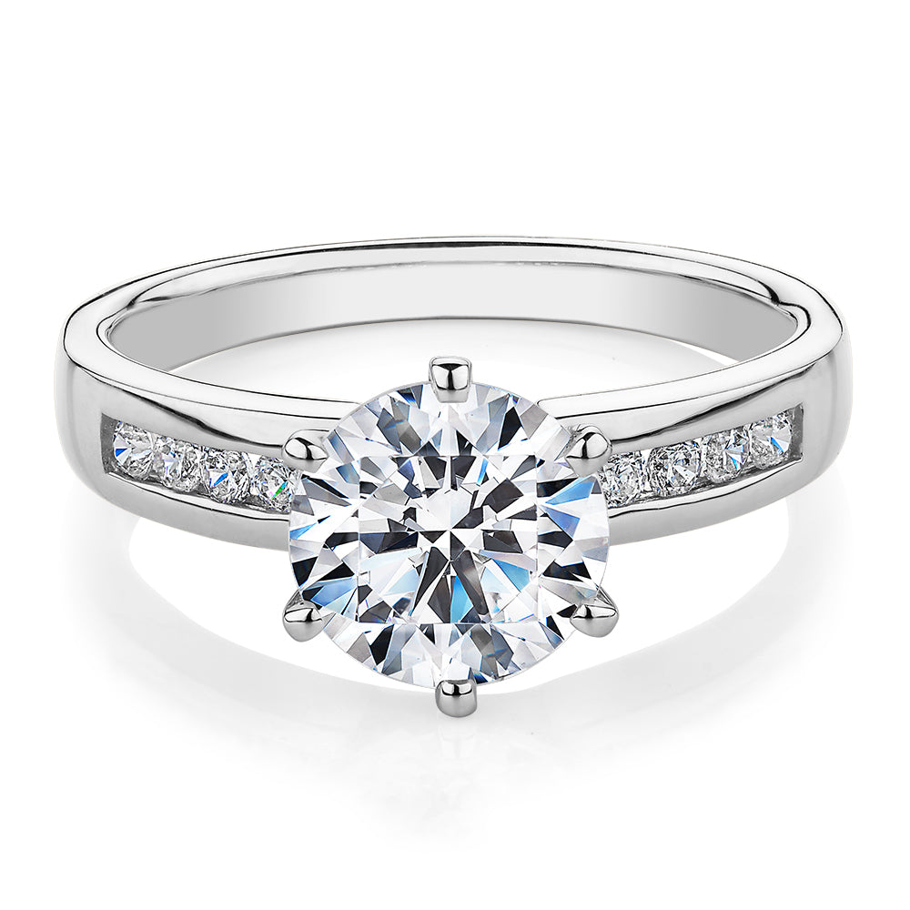Round Brilliant shouldered engagement ring with 2.2 carats* of diamond simulants in 14 carat white gold