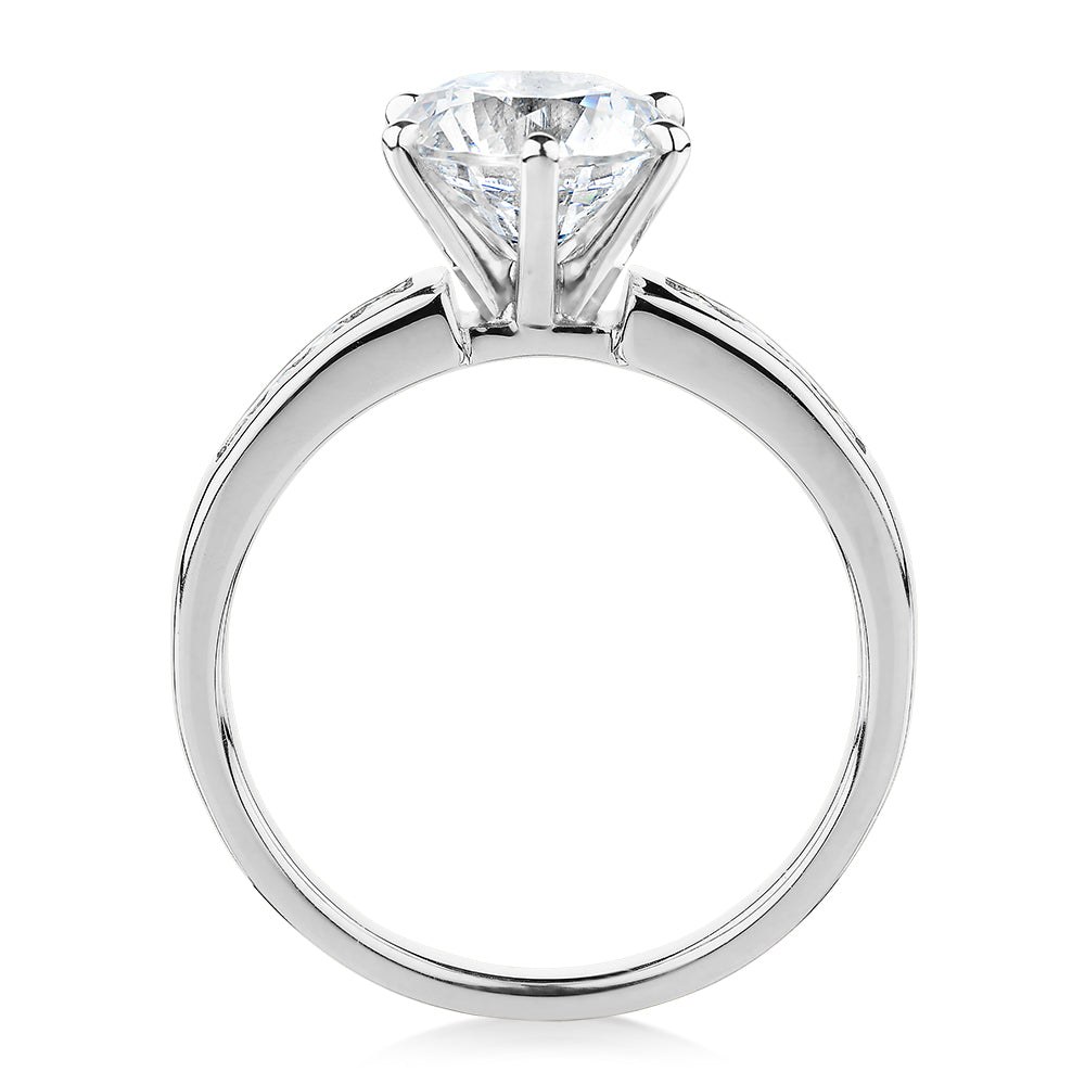 Round Brilliant shouldered engagement ring with 2.2 carats* of diamond simulants in 14 carat white gold