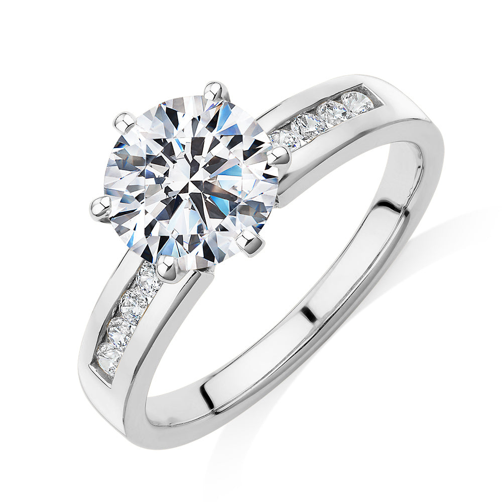 Round Brilliant shouldered engagement ring with 2.2 carats* of diamond simulants in 14 carat white gold