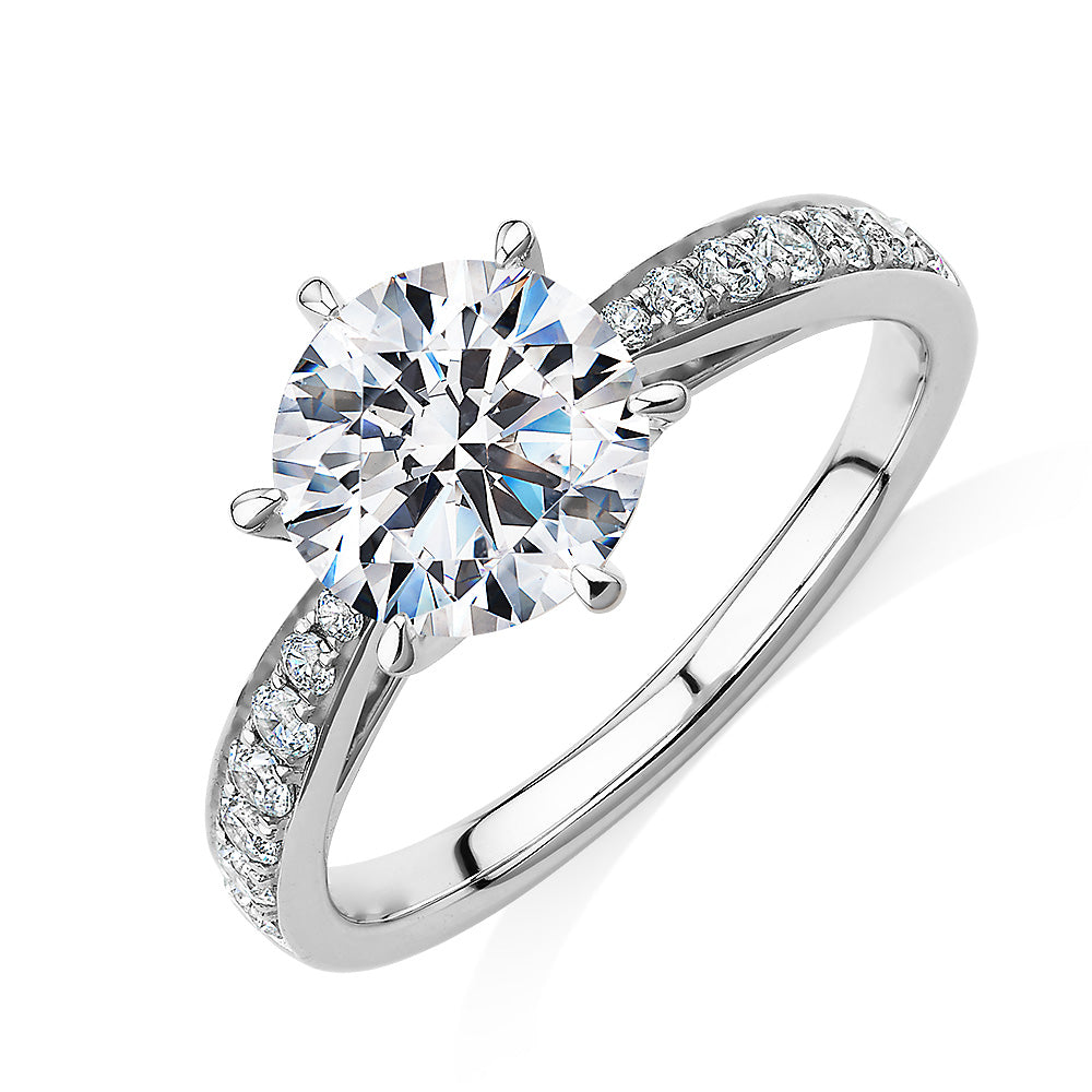Round Brilliant shouldered engagement ring with 2.3 carats* of diamond simulants in 14 carat white gold
