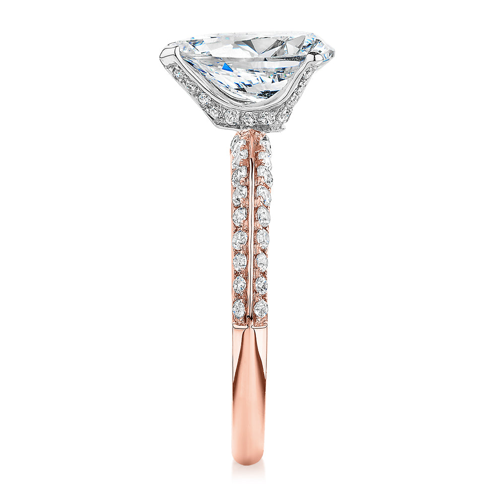 Pear shouldered engagement ring with 2.22 carats* of diamond simulants in 14 carat rose and white gold