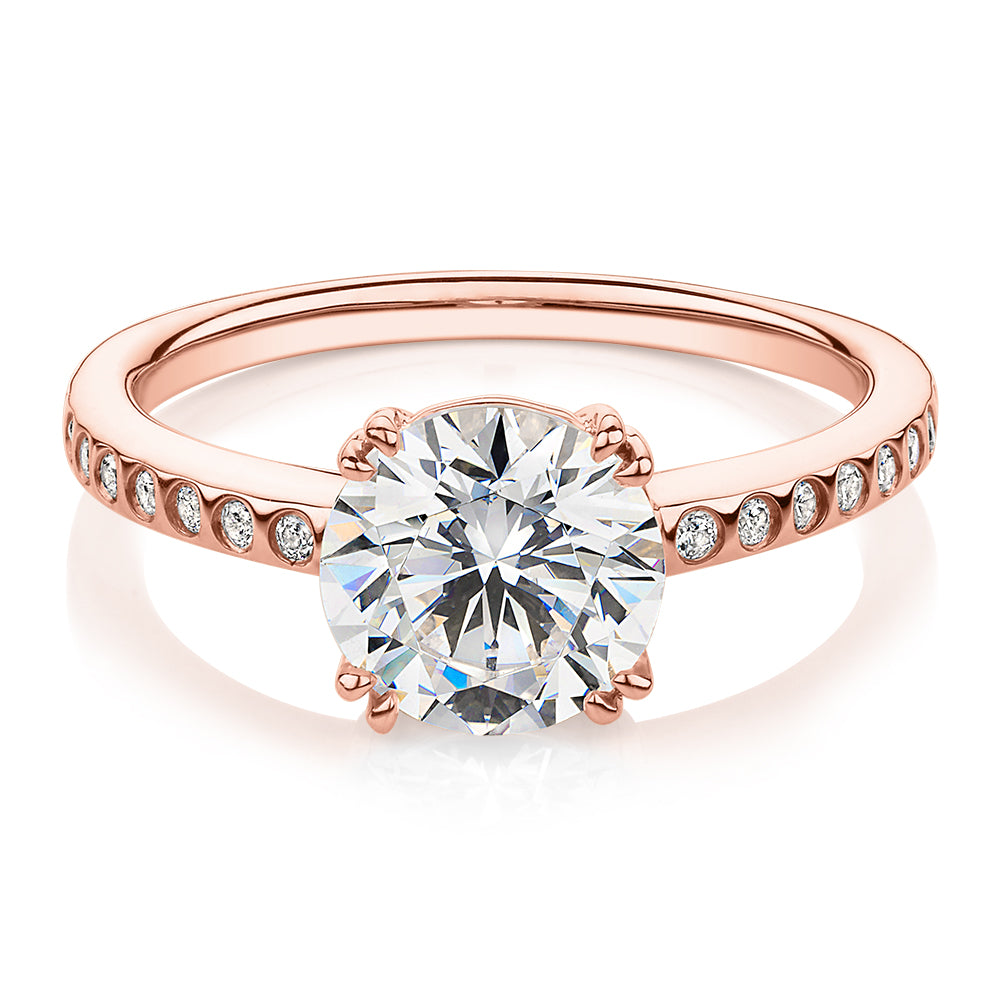 Round Brilliant shouldered engagement ring with 2.17 carats* of diamond simulants in 14 carat rose gold