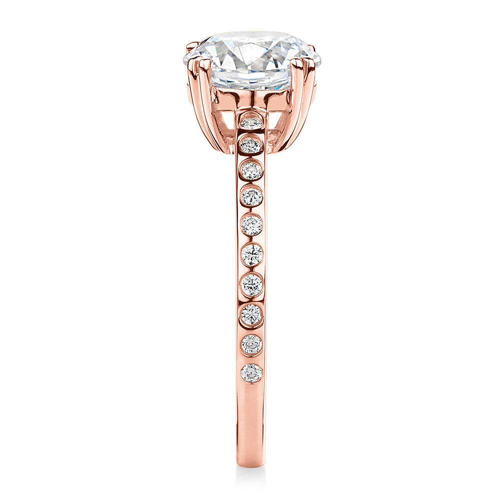 Round Brilliant shouldered engagement ring with 2.17 carats* of diamond simulants in 14 carat rose gold