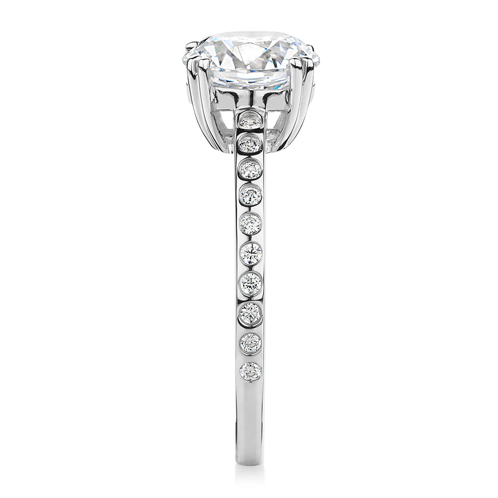 Round Brilliant shouldered engagement ring with 2.17 carats* of diamond simulants in 14 carat white gold