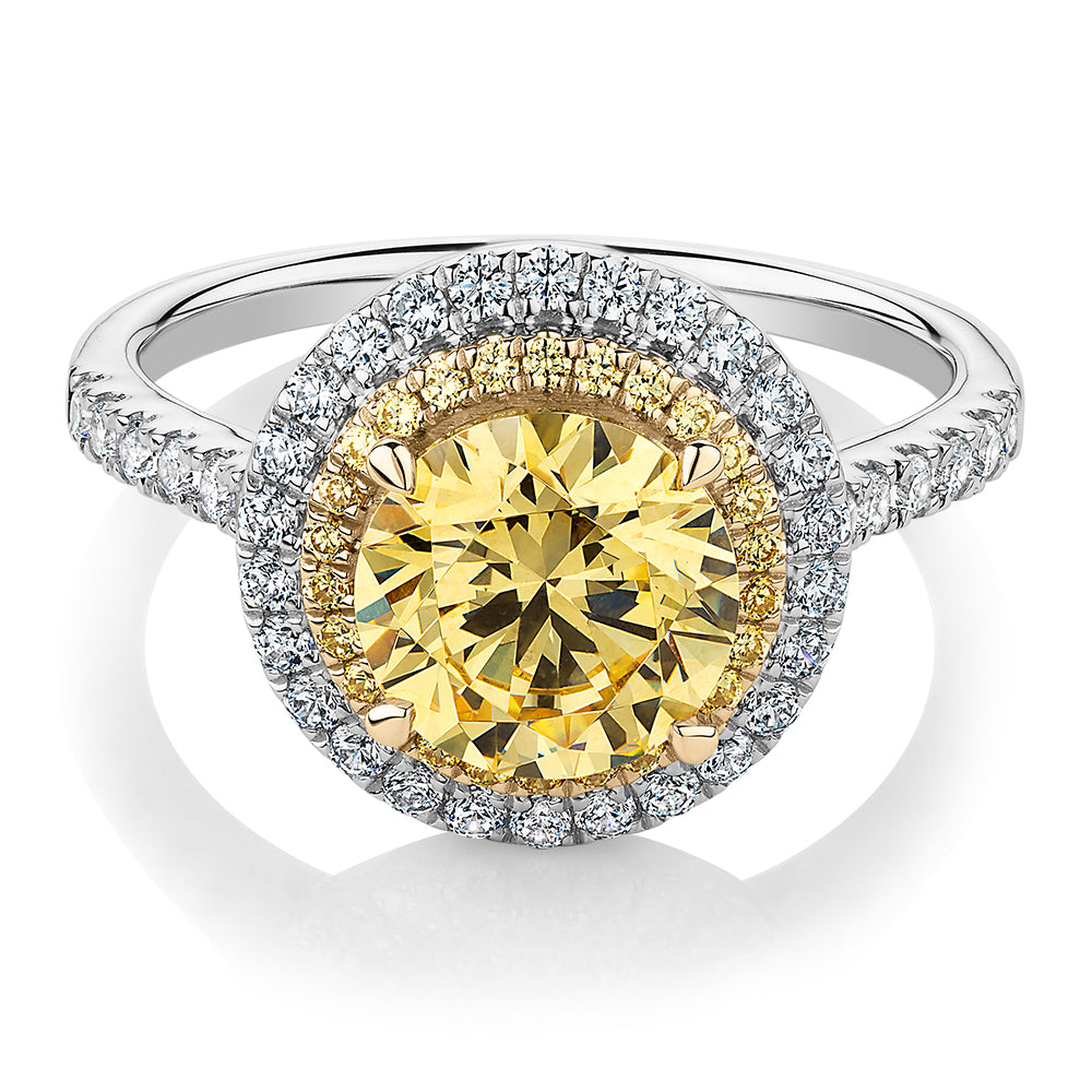 Round Brilliant halo engagement ring with 2.55 carats* of diamond simulants in 10 carat white and yellow gold