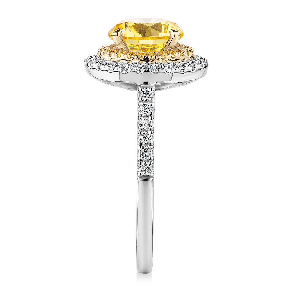 Round Brilliant halo engagement ring with 2.55 carats* of diamond simulants in 10 carat white and yellow gold