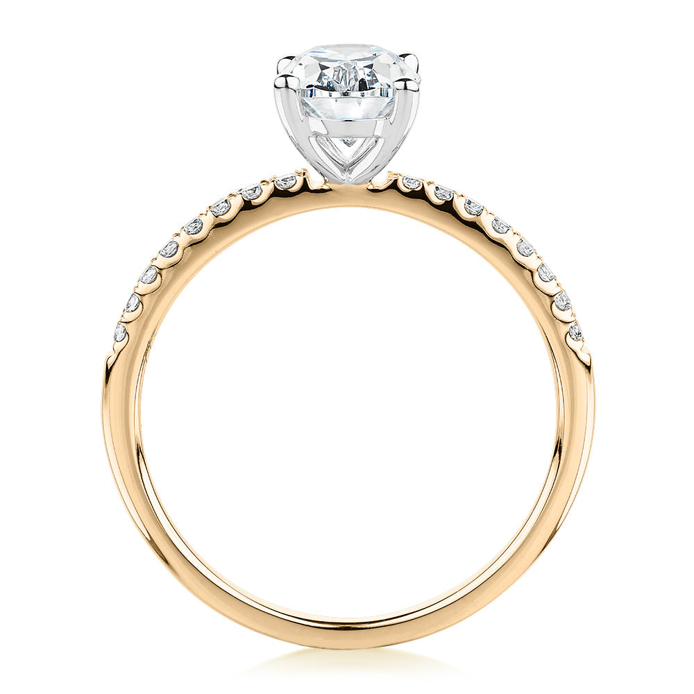 Oval and Round Brilliant shouldered engagement ring with 1.35 carats* of diamond simulants in 14 carat yellow and white gold