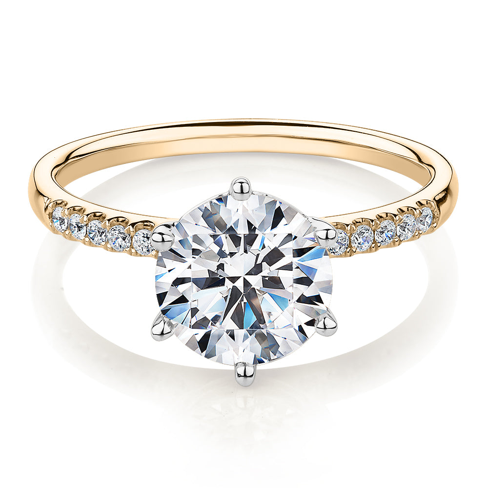 Round Brilliant shouldered engagement ring with 2.12 carats* of diamond simulants in 14 carat yellow and white gold