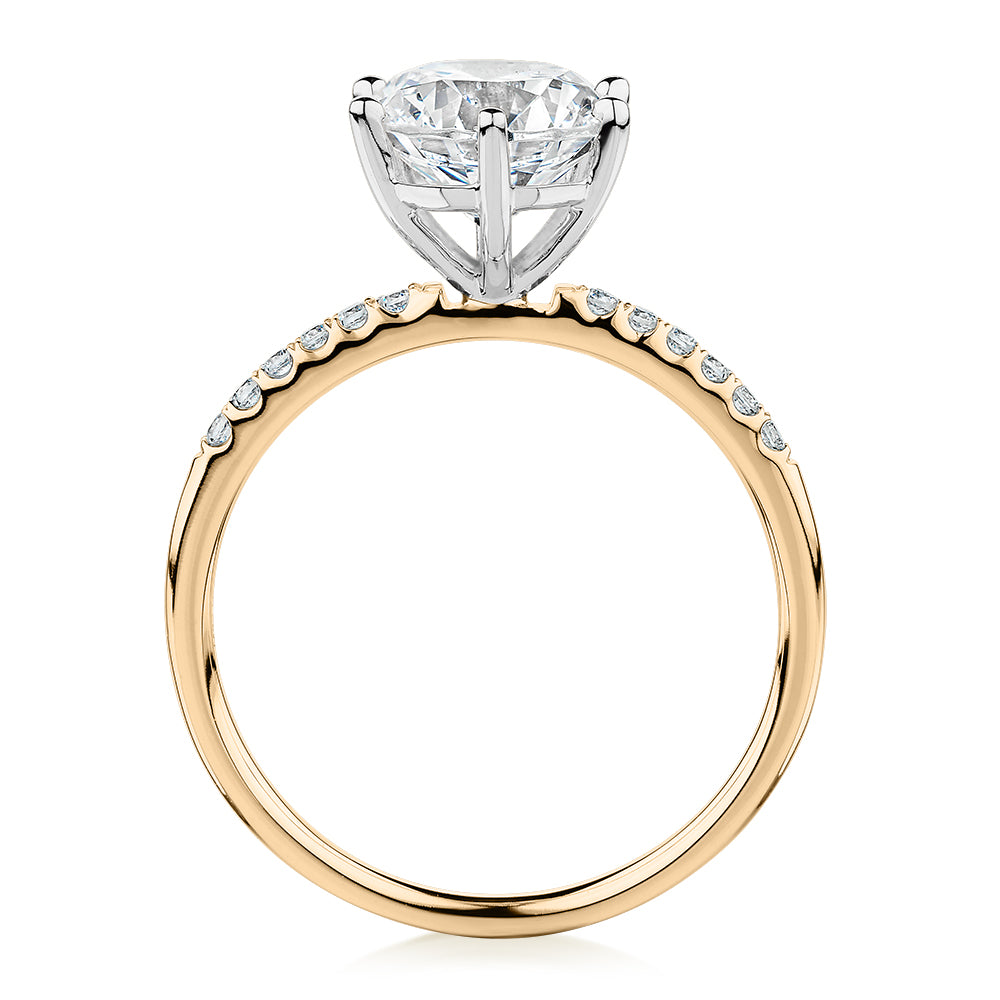 Round Brilliant shouldered engagement ring with 2.12 carats* of diamond simulants in 14 carat yellow and white gold