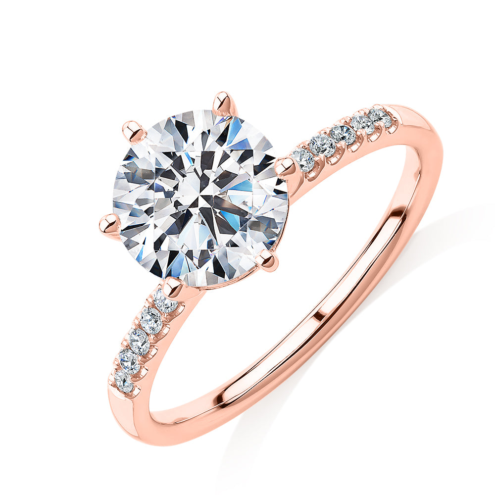 Round Brilliant shouldered engagement ring with 2.12 carats* of diamond simulants in 14 carat rose gold