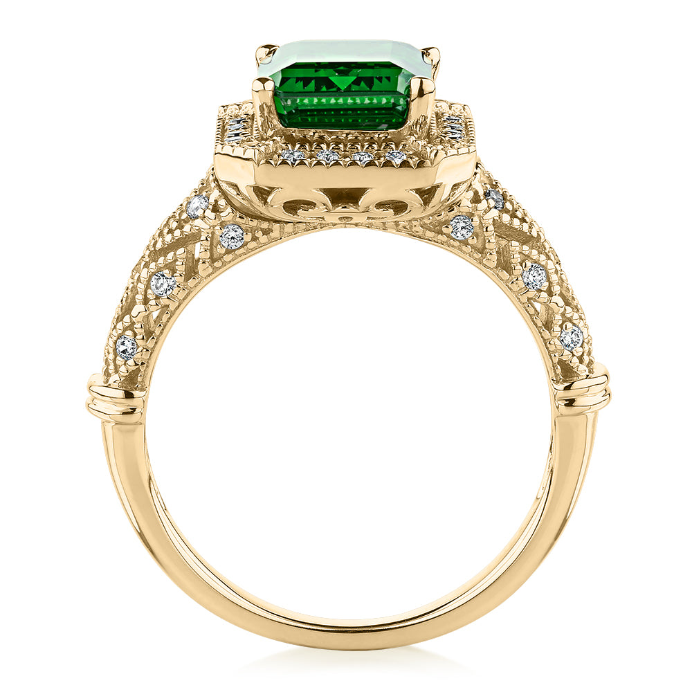 Dress ring with 9x7mm emerald simulant and 0.27 carats* of diamond simulants in 10 carat yellow gold