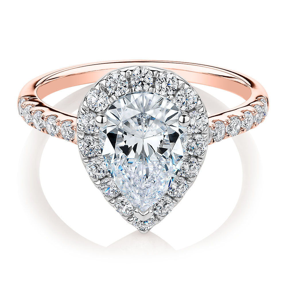 Pear and Round Brilliant halo engagement ring with 2.38 carats* of diamond simulants in 10 carat rose and white gold