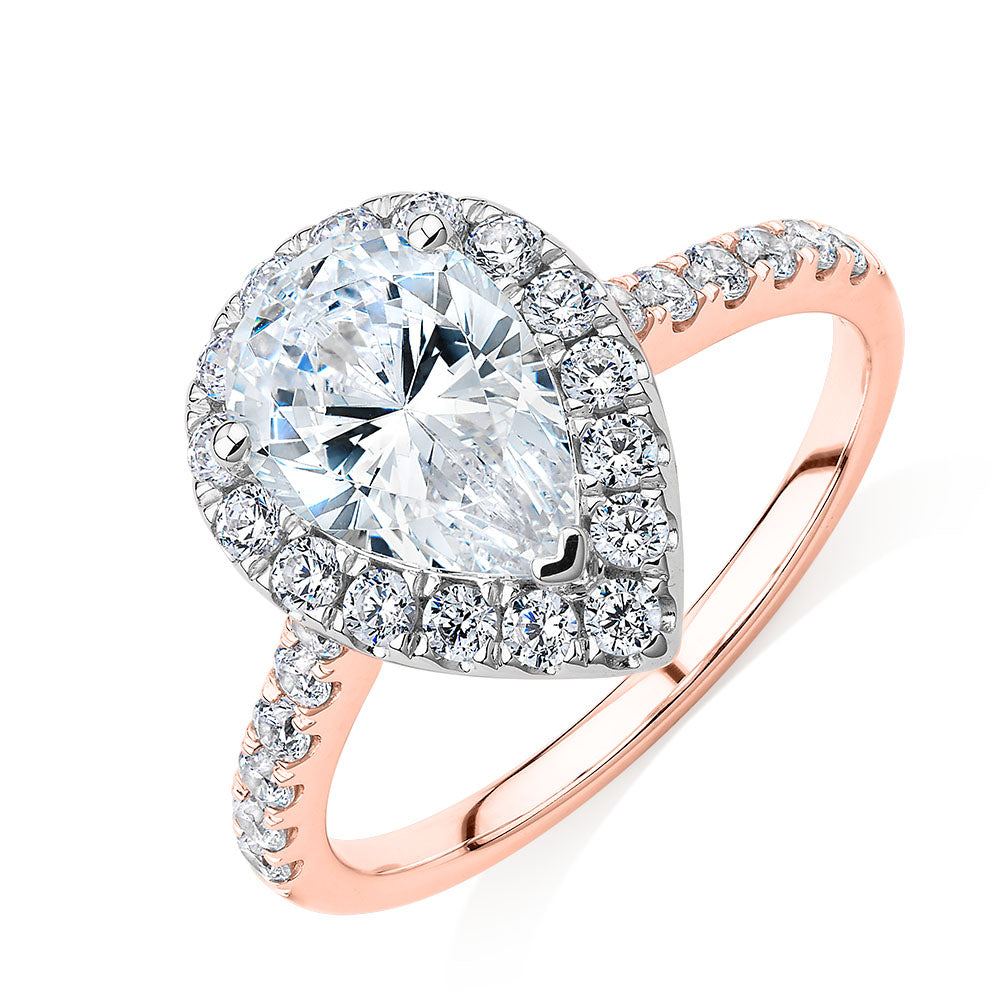 Pear and Round Brilliant halo engagement ring with 2.38 carats* of diamond simulants in 10 carat rose and white gold
