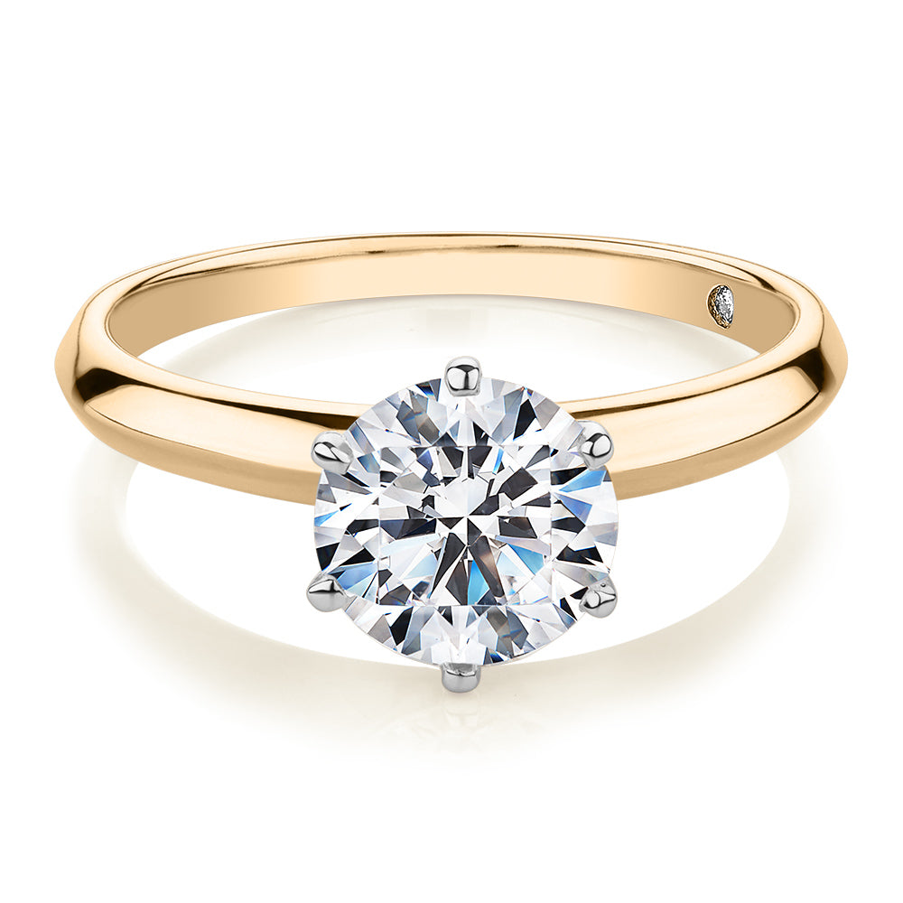 Round Brilliant solitaire engagement ring with 1.5 carat* diamond simulant in 14 carat yellow and white gold
