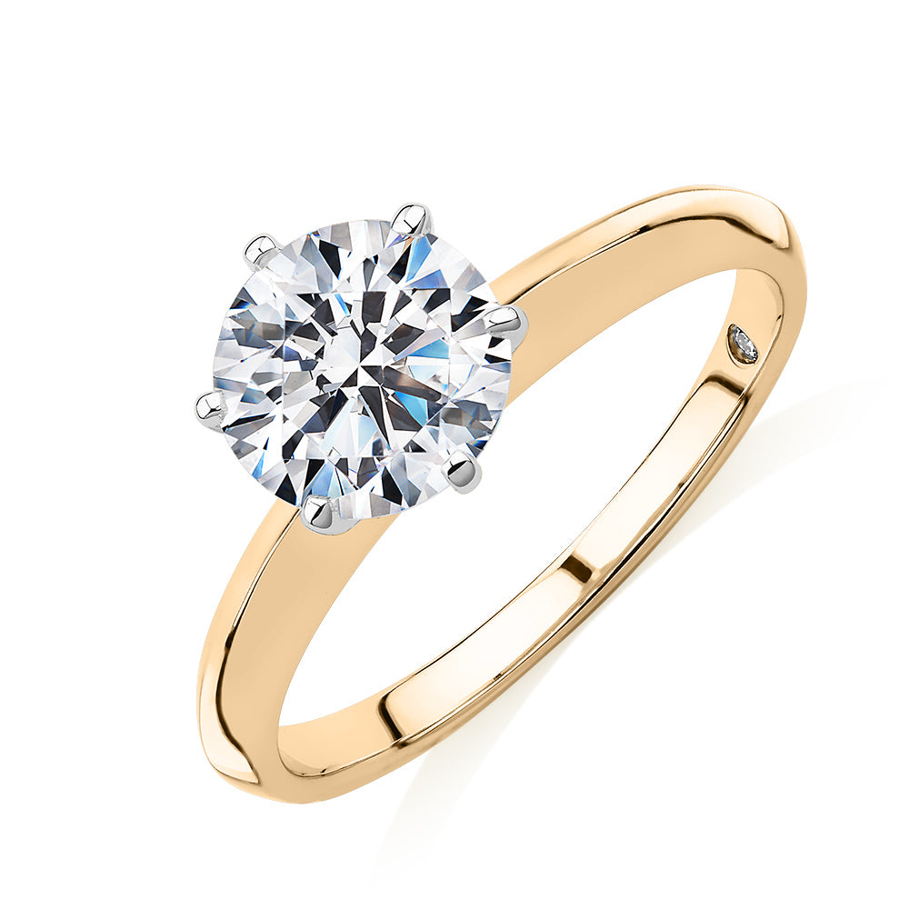 Round Brilliant solitaire engagement ring with 1.5 carat* diamond simulant in 14 carat yellow and white gold