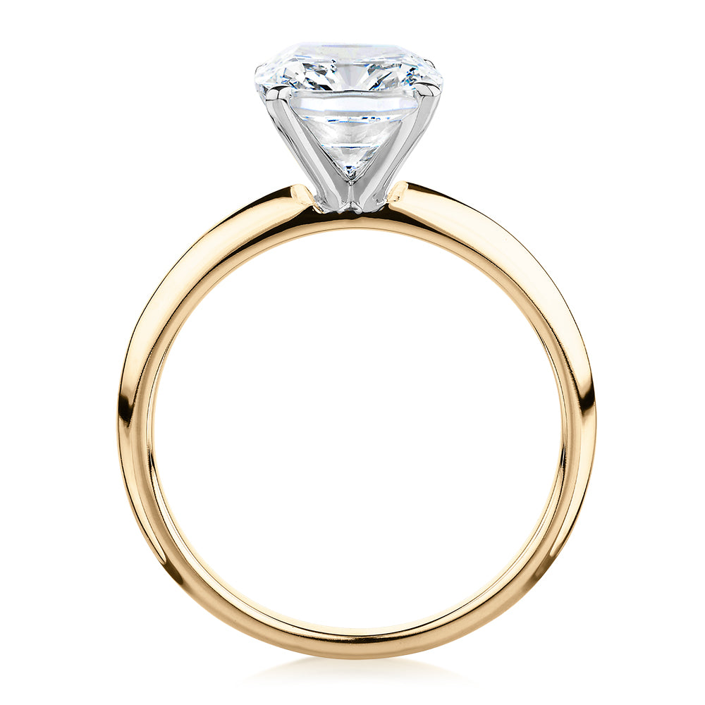 Cushion Radiant solitaire engagement ring with 3.49 carat* diamond simulant in 14 carat yellow and white gold