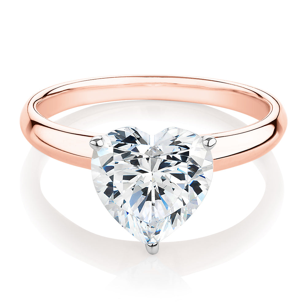 Heart solitaire engagement ring with 2.41 carat* diamond simulant in 14 carat rose and white gold
