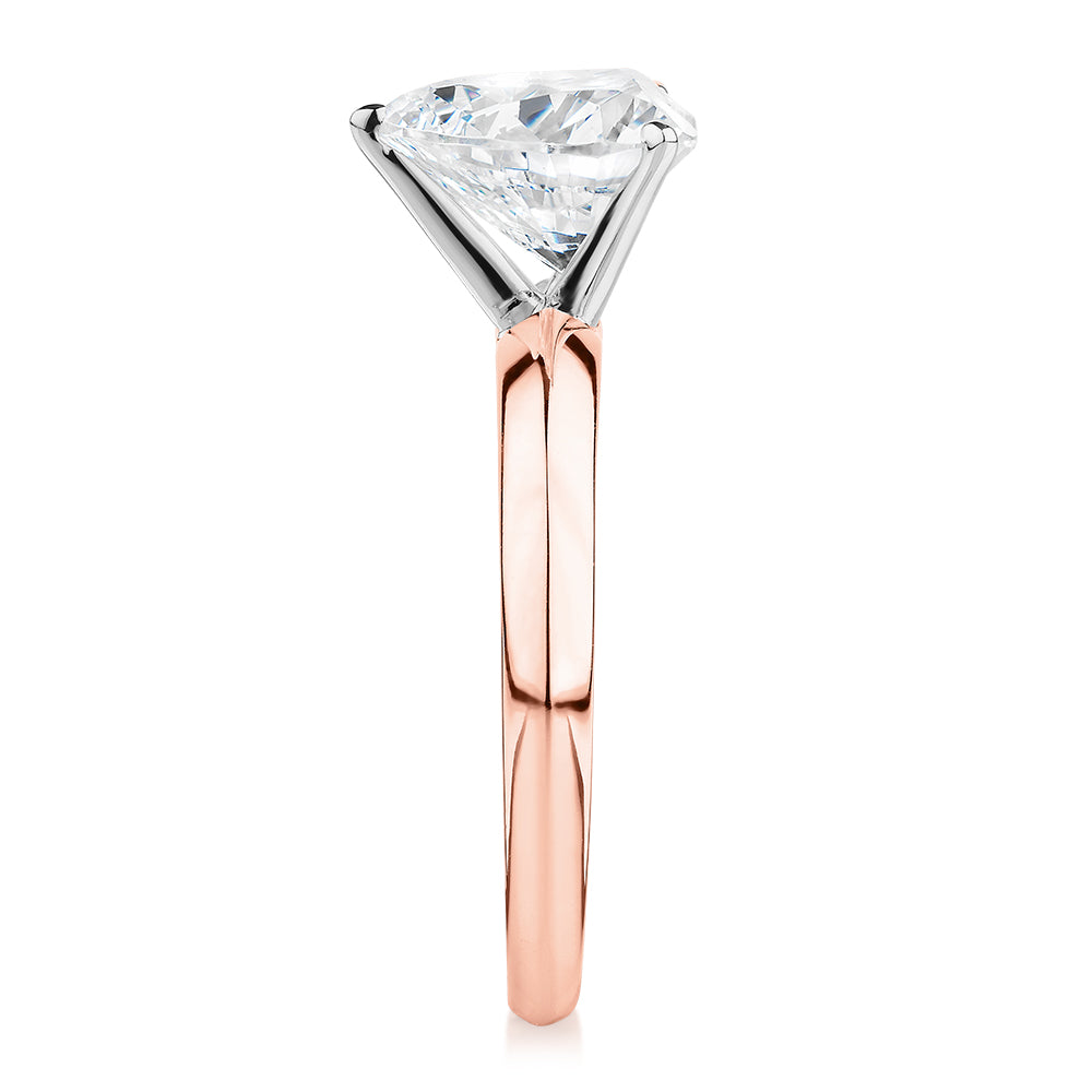 Heart solitaire engagement ring with 2.41 carat* diamond simulant in 14 carat rose and white gold
