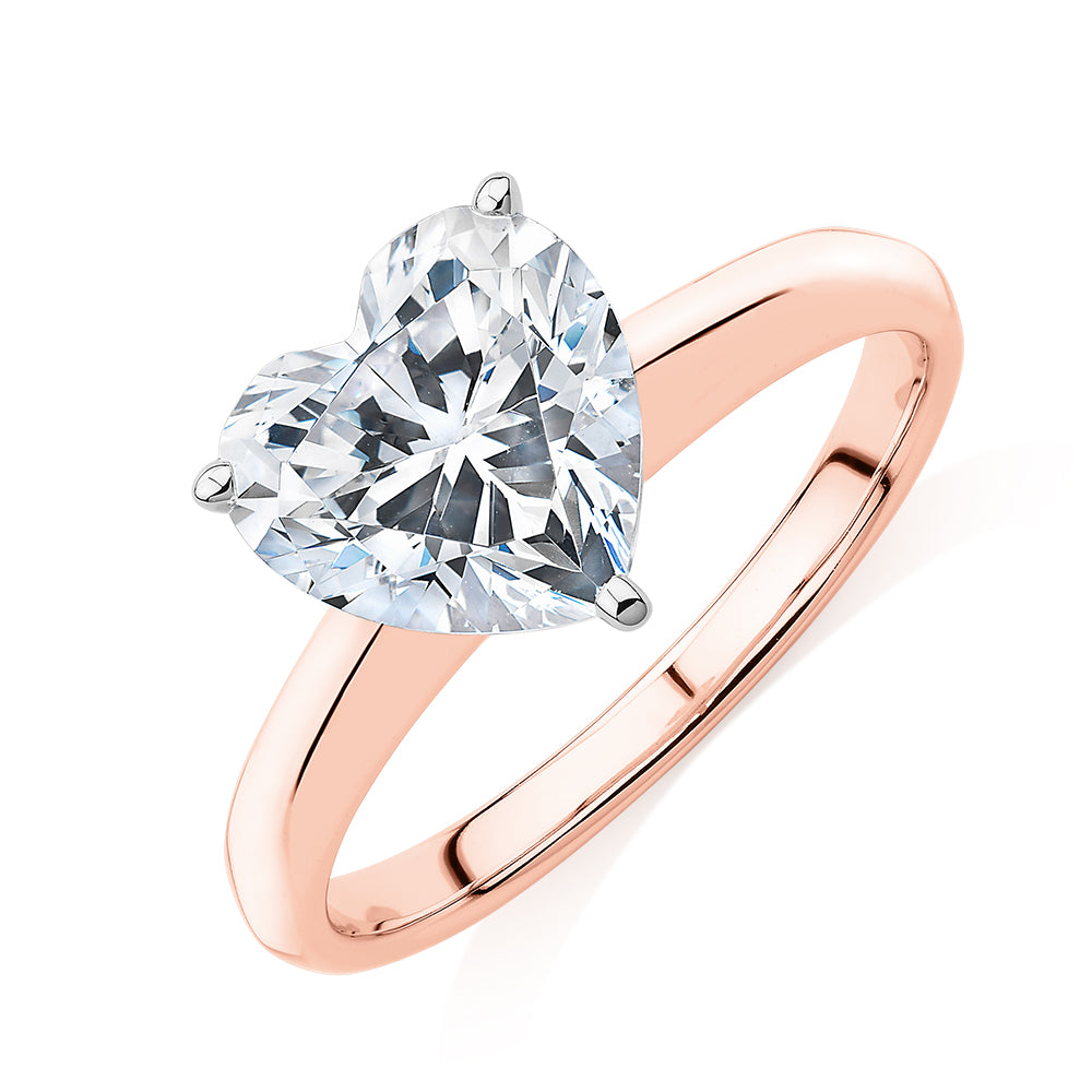 Heart solitaire engagement ring with 2.41 carat* diamond simulant in 14 carat rose and white gold