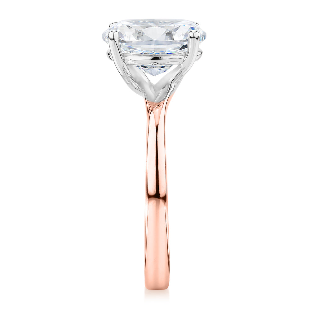 Oval solitaire engagement ring with 2.54 carat* diamond simulant in 14 carat rose and white gold