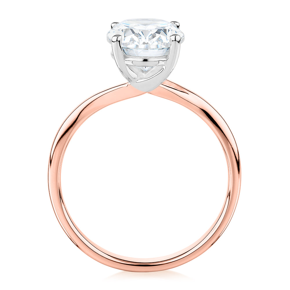 Oval solitaire engagement ring with 2.54 carat* diamond simulant in 14 carat rose and white gold