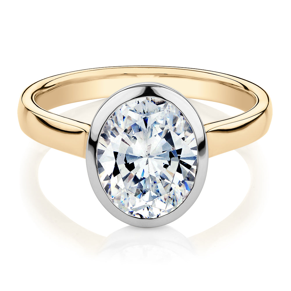 Oval solitaire engagement ring with 2.54 carat* diamond simulant in 14 carat yellow and white gold