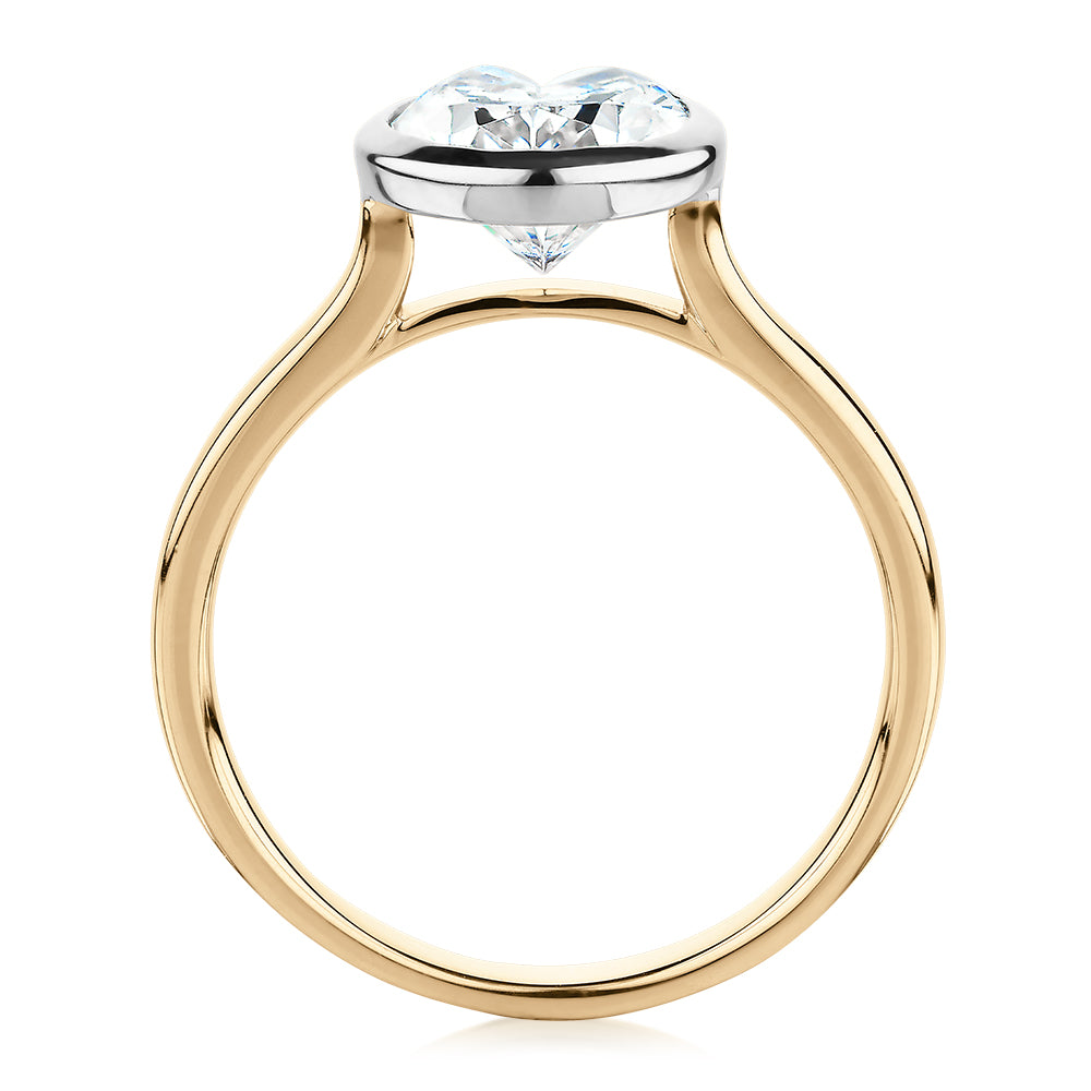 Oval solitaire engagement ring with 2.54 carat* diamond simulant in 14 carat yellow and white gold
