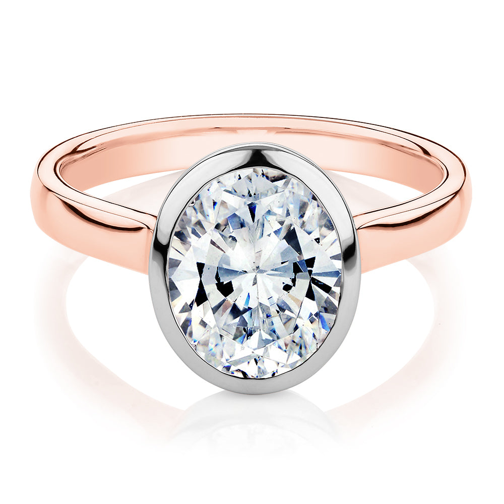 Oval solitaire engagement ring with 2.54 carat* diamond simulant in 14 carat rose and white gold