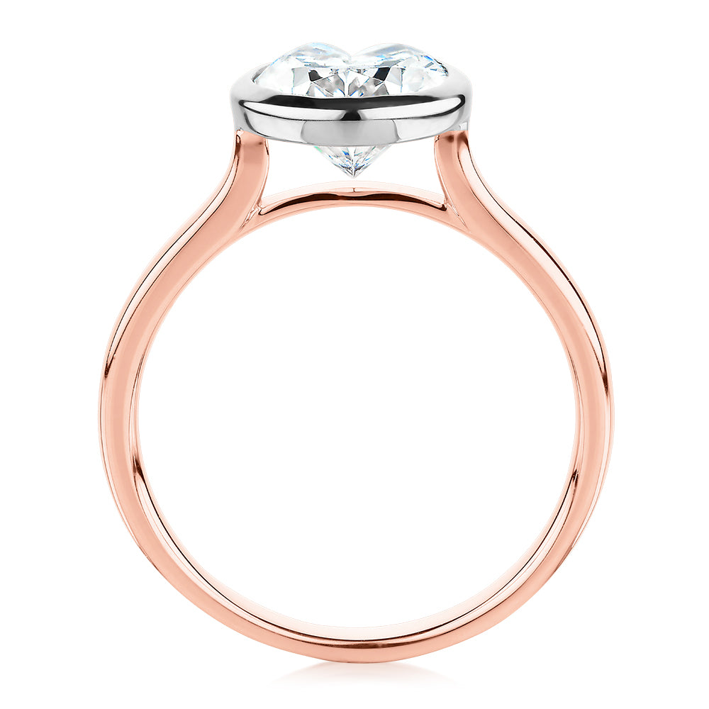 Oval solitaire engagement ring with 2.54 carat* diamond simulant in 14 carat rose and white gold
