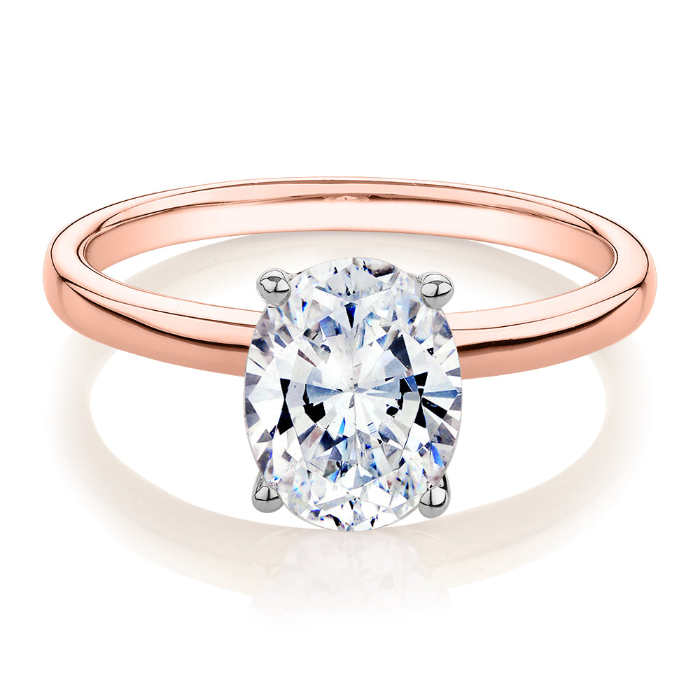 Oval solitaire engagement ring with 1.86 carat* diamond simulant in 14 carat rose gold