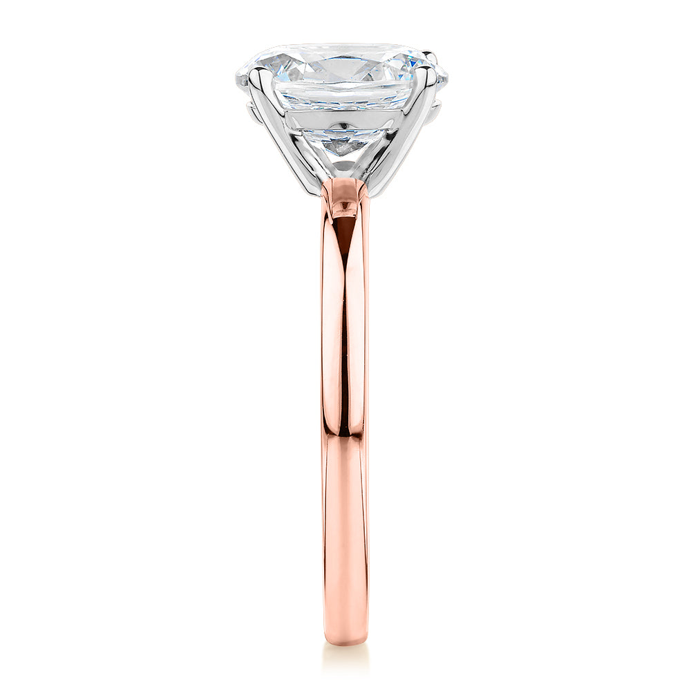 Oval solitaire engagement ring with 1.86 carat* diamond simulant in 14 carat rose gold