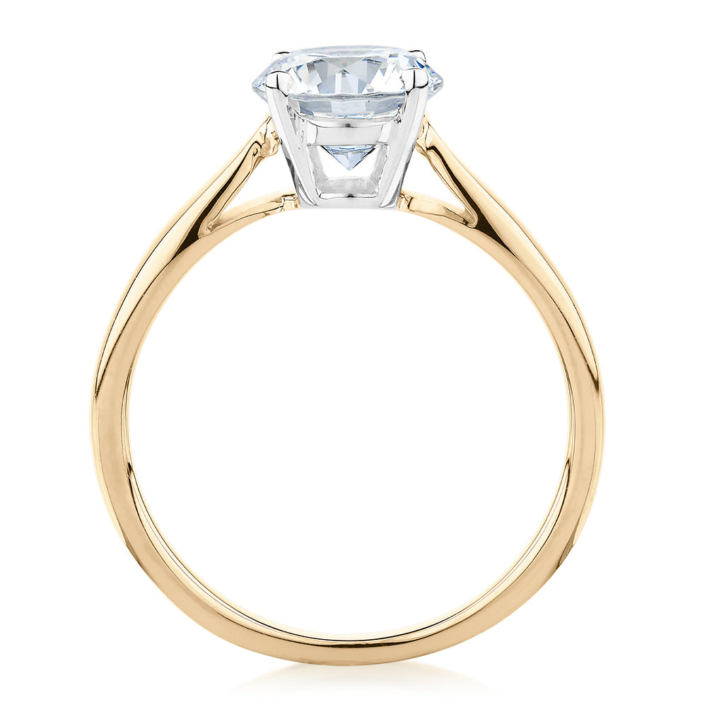 Round Brilliant solitaire engagement ring with 1.5 carat* diamond simulant in 14 carat yellow and white gold