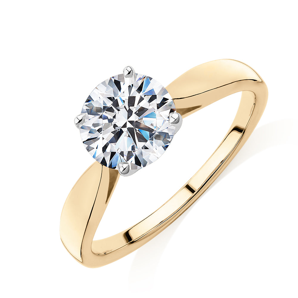 Round Brilliant solitaire engagement ring with 1.5 carat* diamond simulant in 14 carat yellow and white gold