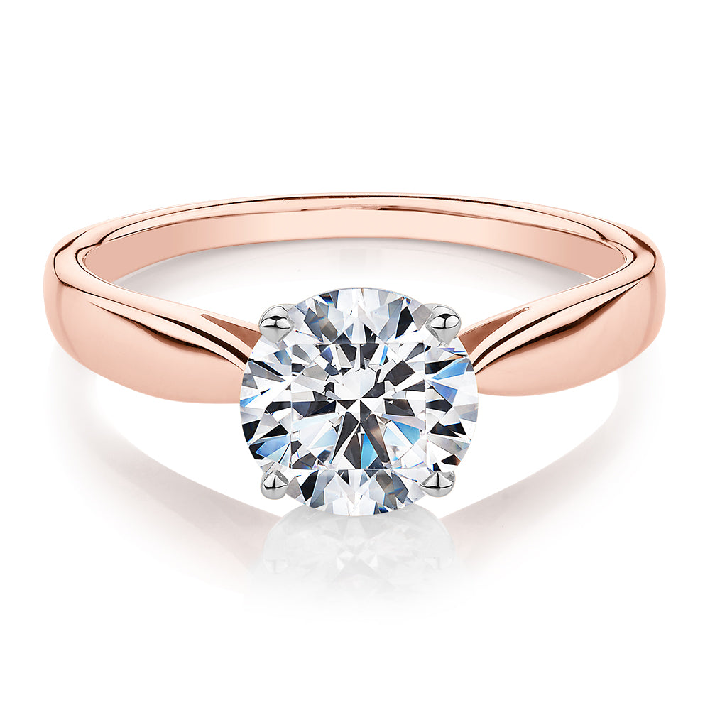 Round Brilliant solitaire engagement ring with 1.5 carat* diamond simulant in 14 carat rose and white gold