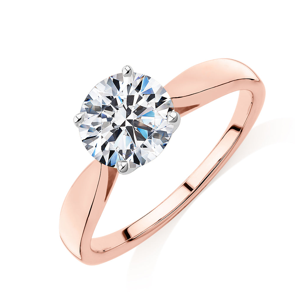 Round Brilliant solitaire engagement ring with 1.5 carat* diamond simulant in 14 carat rose and white gold