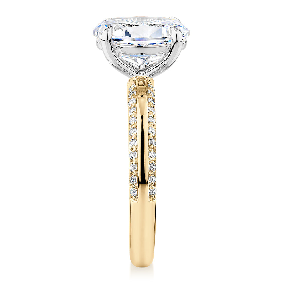 Signature Simulant Diamond 2.24 carat* TW oval cut shouldered engagement ring in 14 carat yellow and white gold