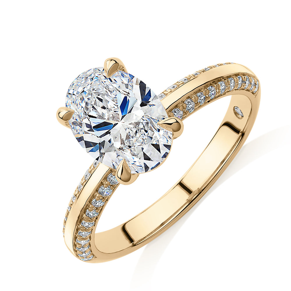 Signature Simulant Diamond 2.24 carat* TW round oval cut engagement ring in 14 carat yellow gold