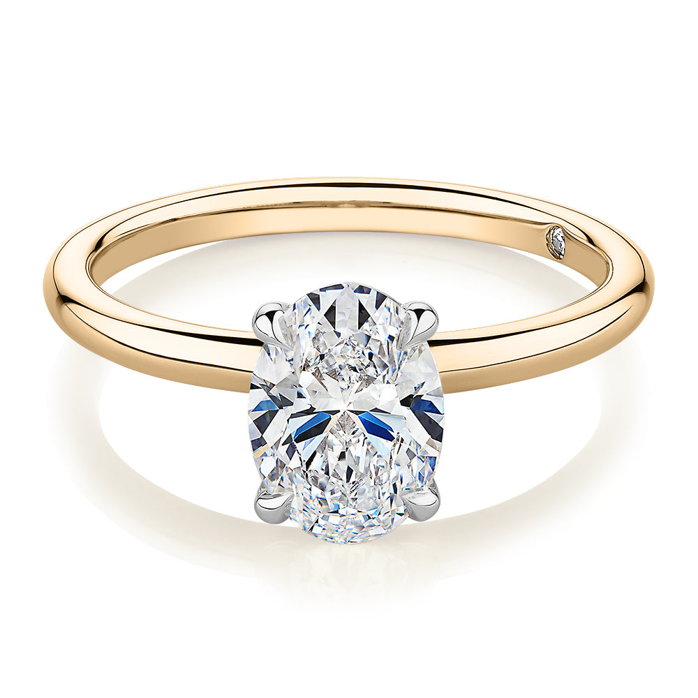 Signature Simulant Diamond 1.50 carat* oval solitaire engagement ring in 14 carat yellow and white gold