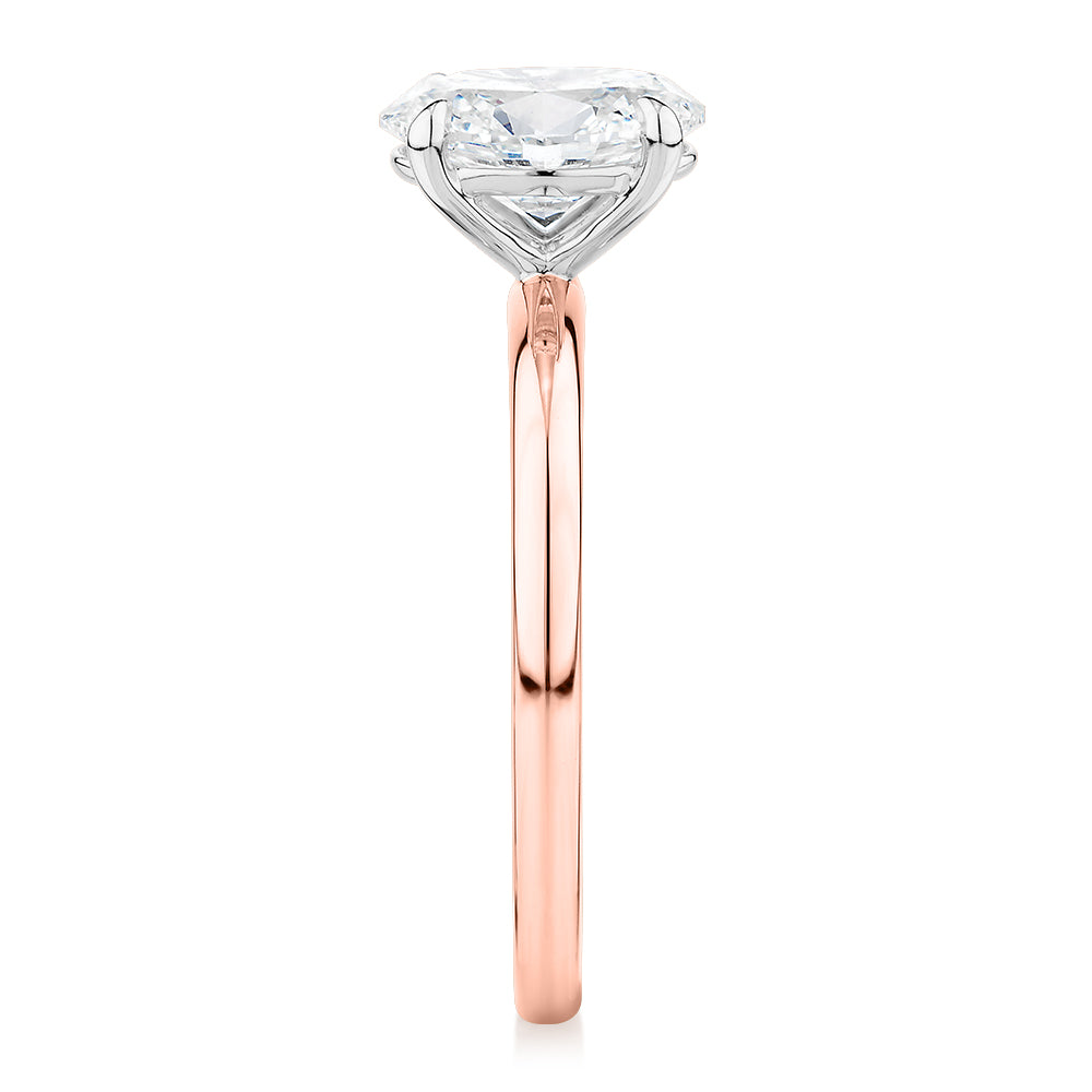 Signature Simulant Diamond 1.50 carat* oval solitaire engagement ring in 14 carat rose and white gold